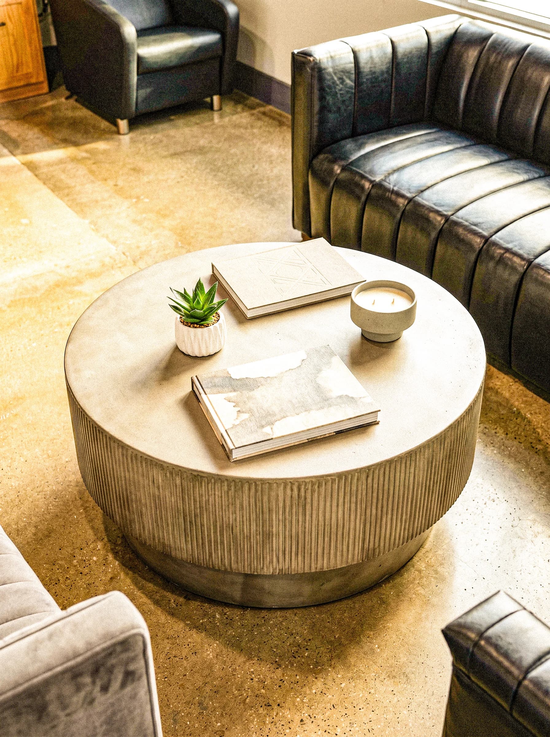 Lounge seating and refreshments inside Zen Barber Lounge