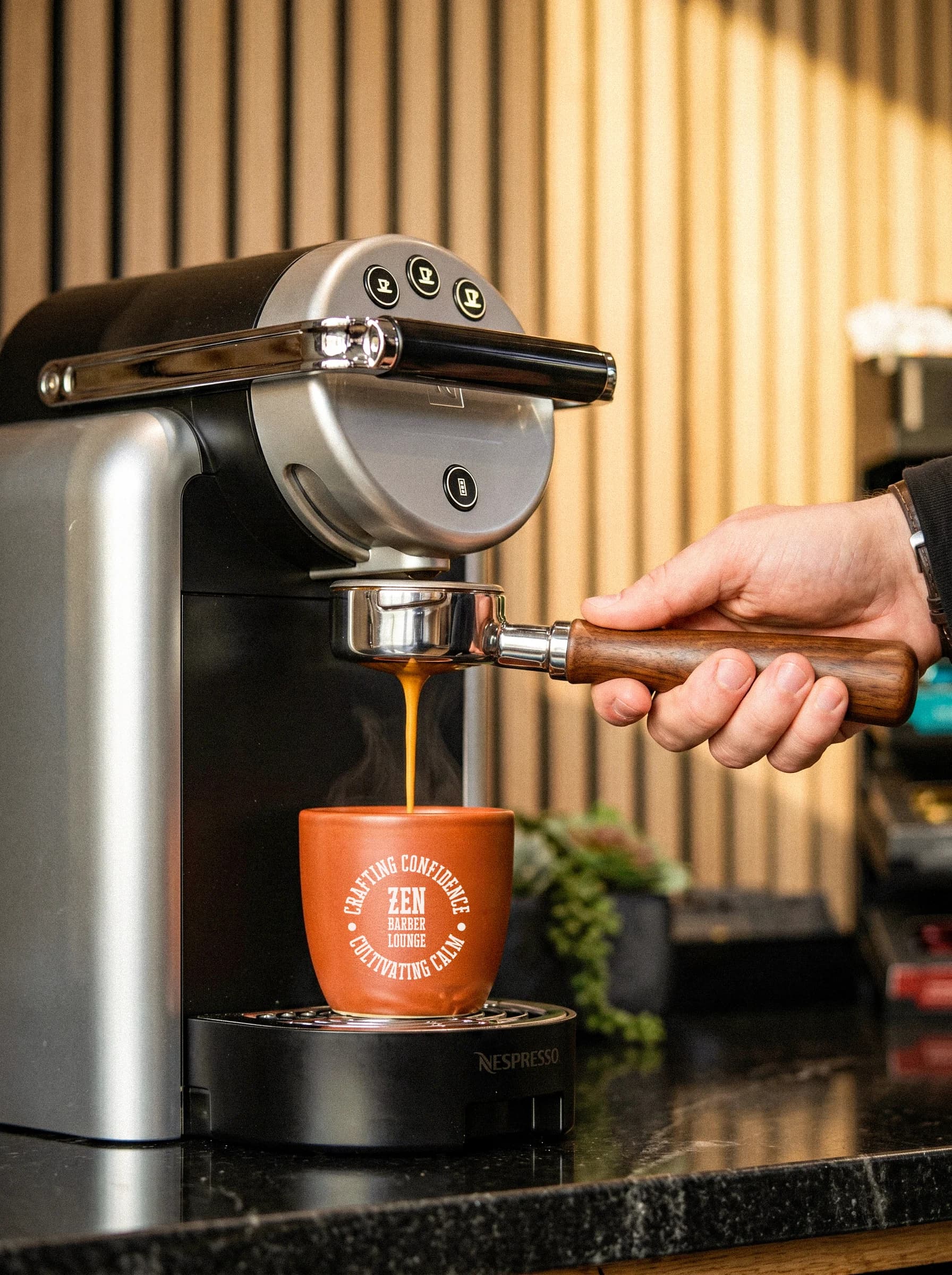Fresh espresso being poured in the Zen Barber Lounge